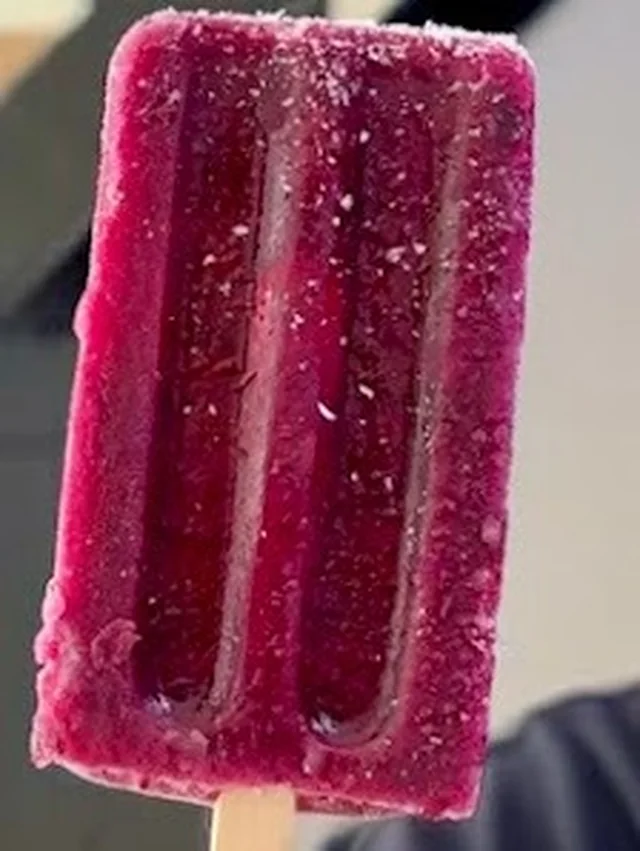 Townly Jamun Sorbet pop on a wooden stick dusted with Himalayan black salt crystals